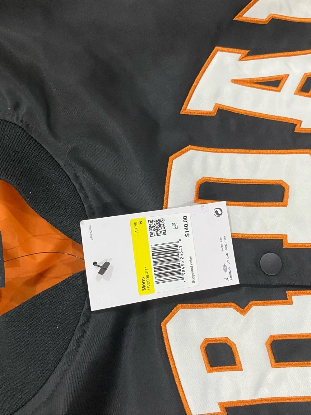 Jordan Black Jacket with White and Orange Lettering